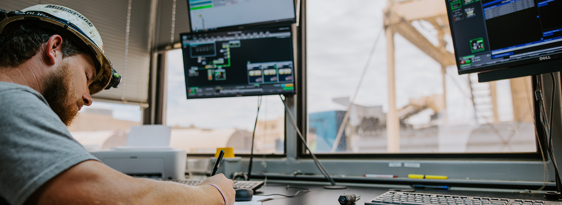 A man works in the control room at spencer quarry