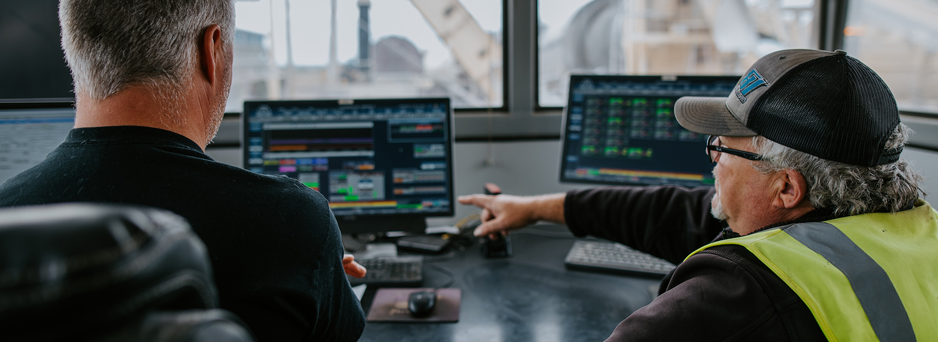 Two spencer quarry employees work together in the office.