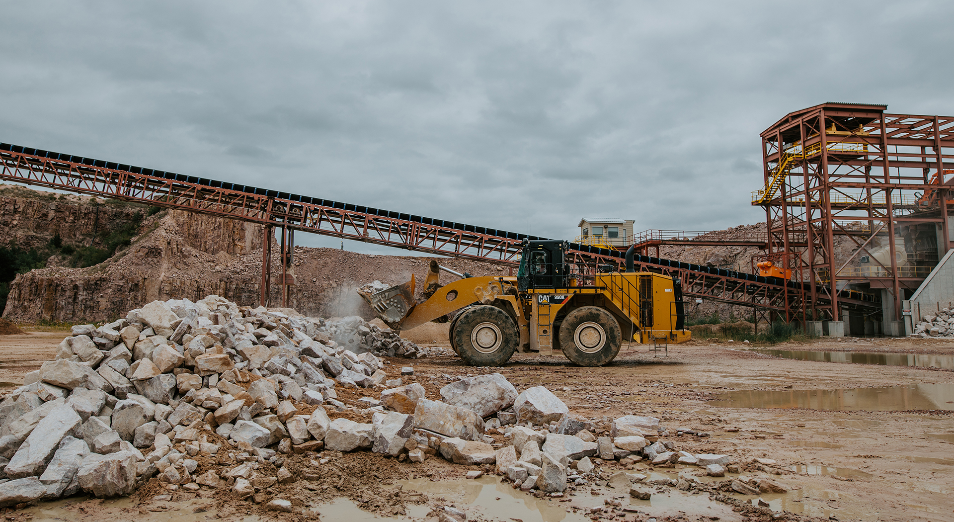 A bulldozer moves rock at spencer quarry